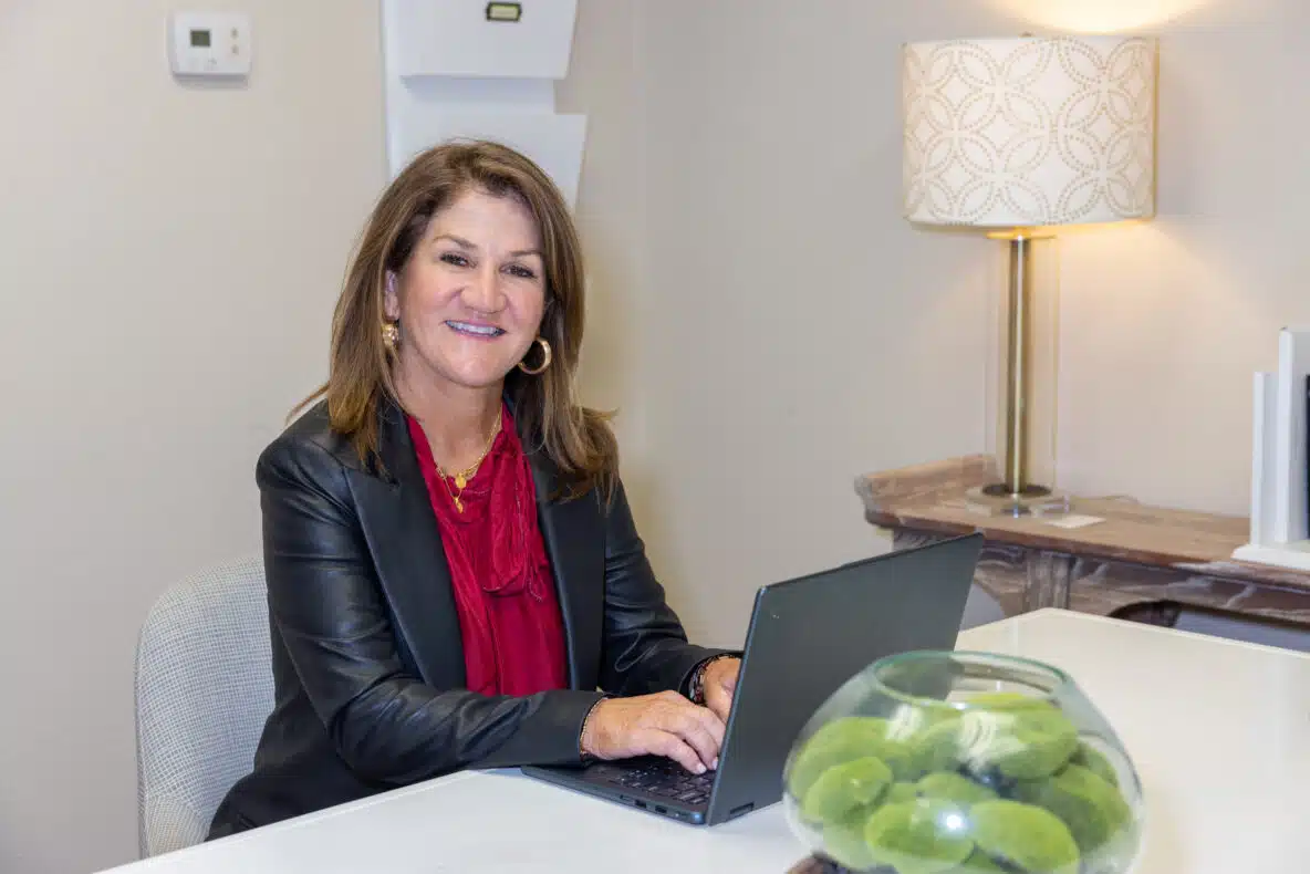 Woman CEO sitting behind desk