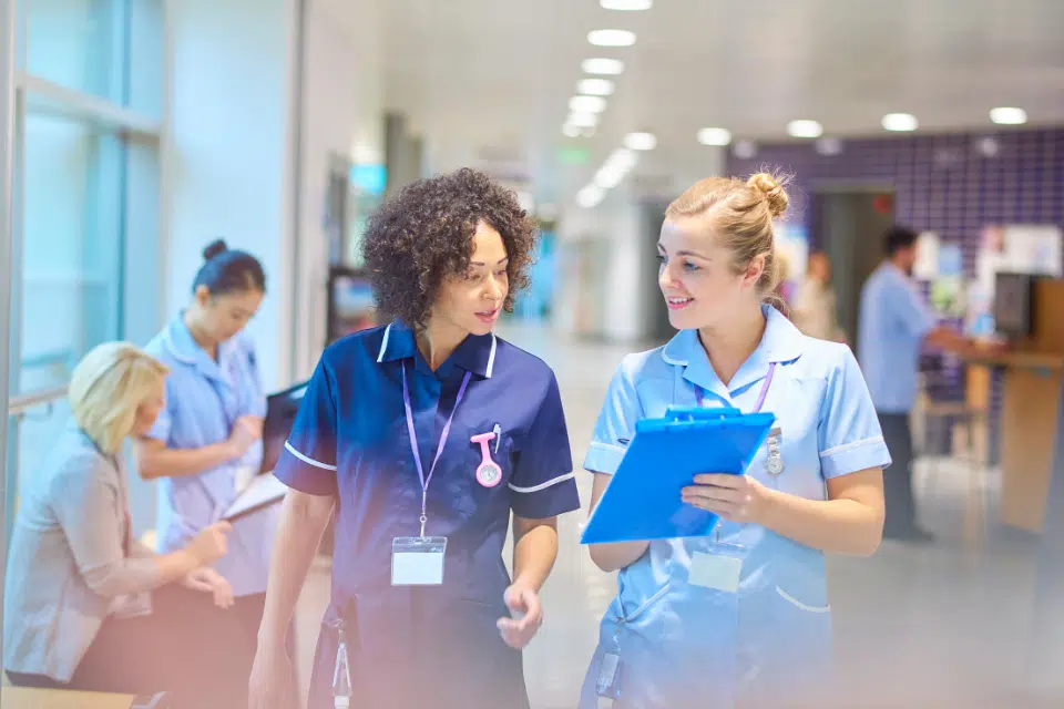 Interim Director of Nursing Conferring with Nurse