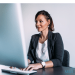 Women Administrator typing on keyboard