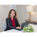Woman President & CEO at Desk Working