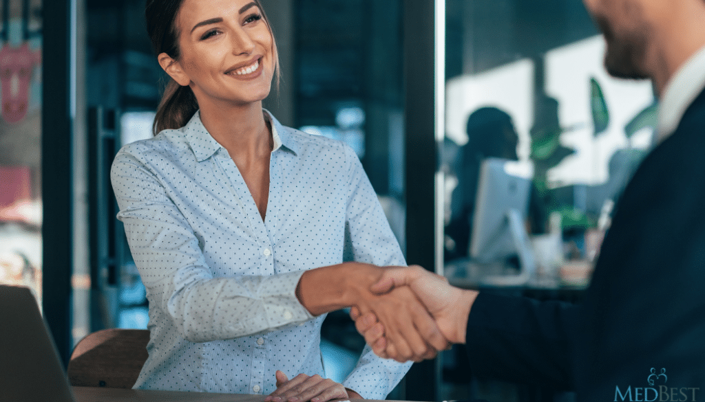 Interim Nursing Home Director is welcomed to a senior living community with a handshake