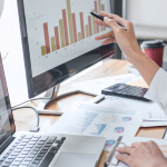 Woman MDS Coordinator charting for senior living residents at senior care facility