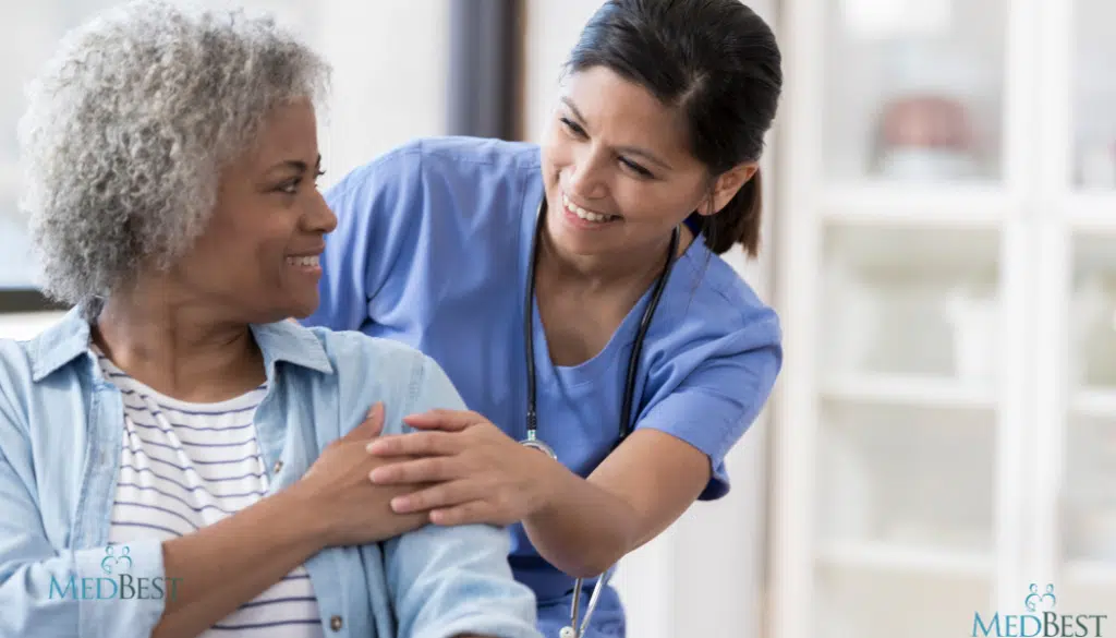 Female Wellness Director sharing a moment with a senior at a senior care community