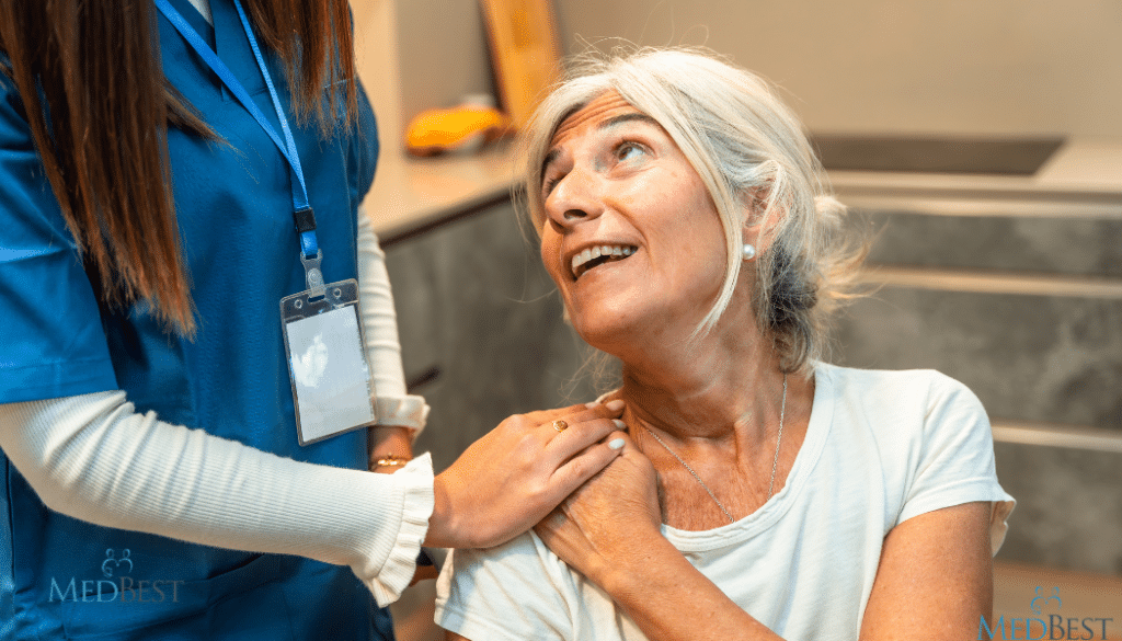 Female Wellness Director reassuring elderly resident at senior care community
