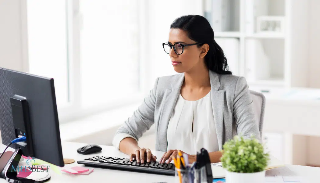 Women in suit at desk in office serving as interim Assisted Living Administrator