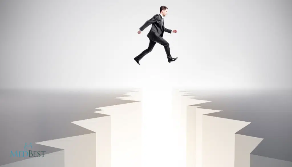 Man in suit jumping over a gap