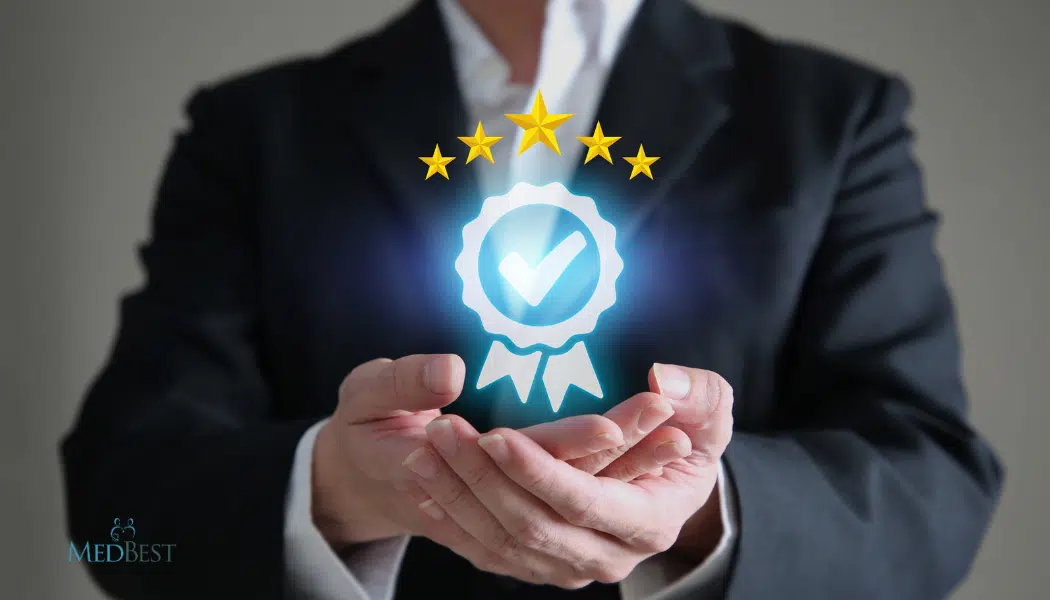 Man in suit holding image that depicts the gold standard